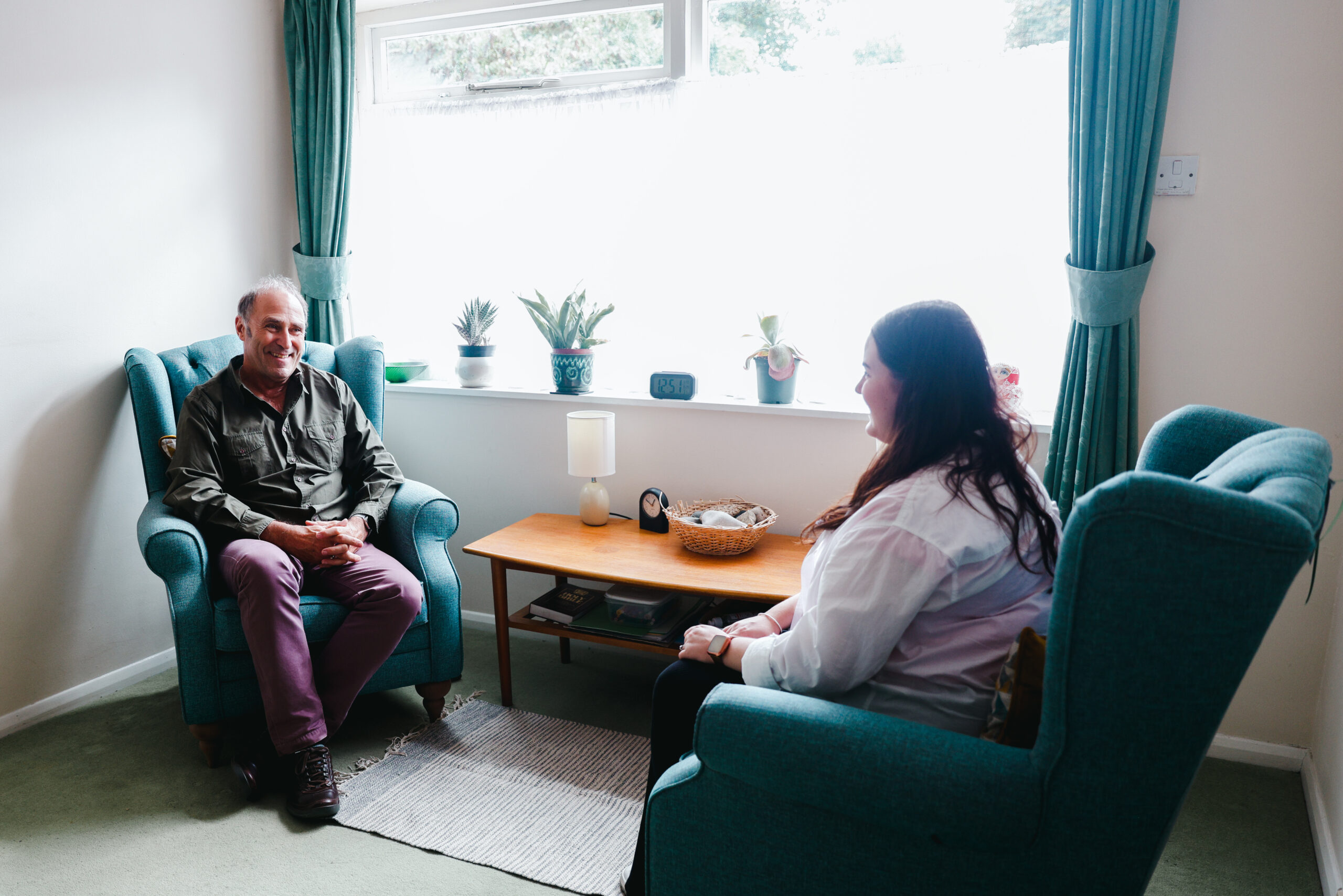 Young woman being helped by Connect Counselling in a comfy room Young woman being helped by Connect Counselling in a comfy room